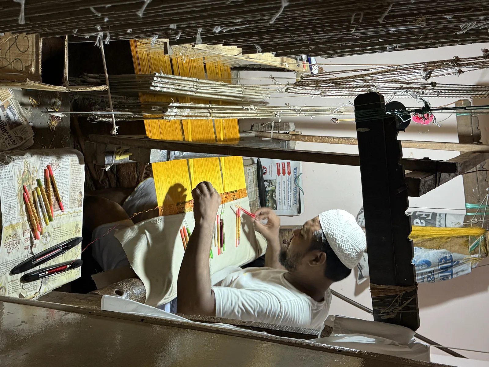 Banarasi silk artisan preparing a handloom pattern for Choubey Silk